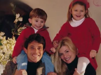 Jordan Belfort is carrying Carter Belfort and Nadine Caridi is carrying Chandler Belfort on their shoulders.